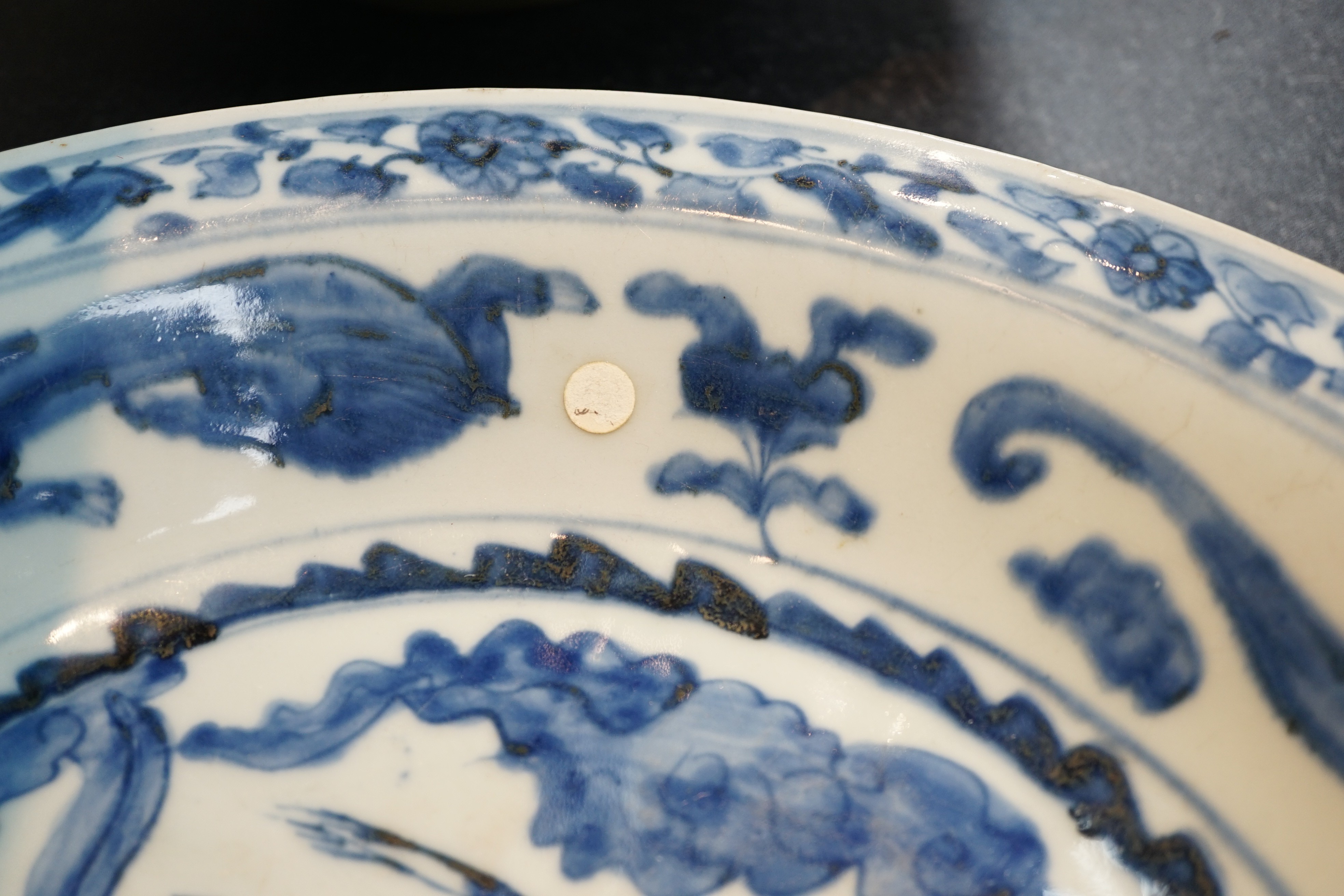 A large Chinese Swatow blue and white ‘Shou Lao’ dish, Zhangzhou kilns, Wanli period, 43.4cm diameter, tiny rim chip